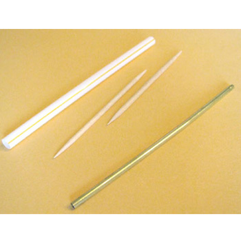 Image of a straw, some toothpicks, and a metal rod. These can make good paper bead rollers.